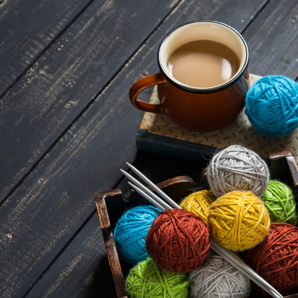 knitting supplies with a hot drink